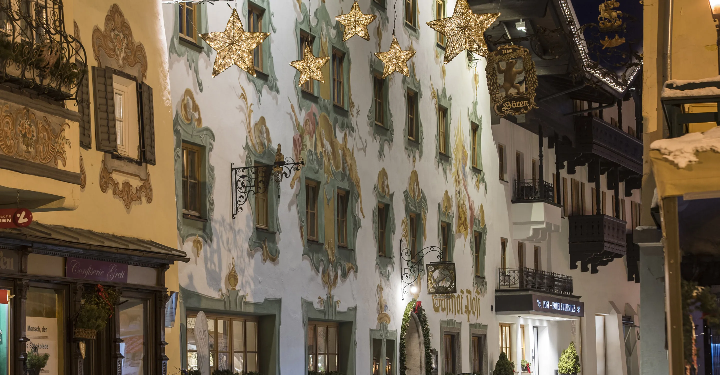 Decorated winter street with lights and ornate buildings