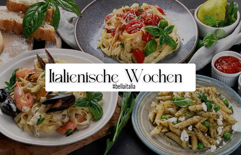 Zwei Pasta-Gerichte mit frischen Zutaten auf einem Tisch.