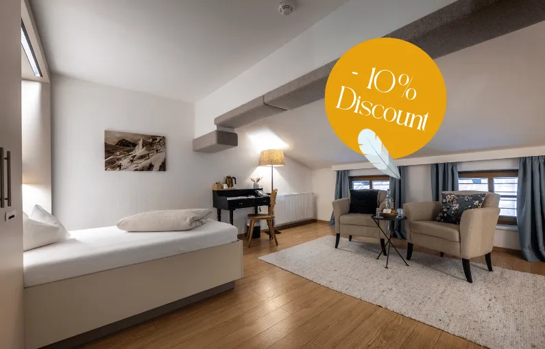 Bright room with a 10% discount offer and cozy furnishings